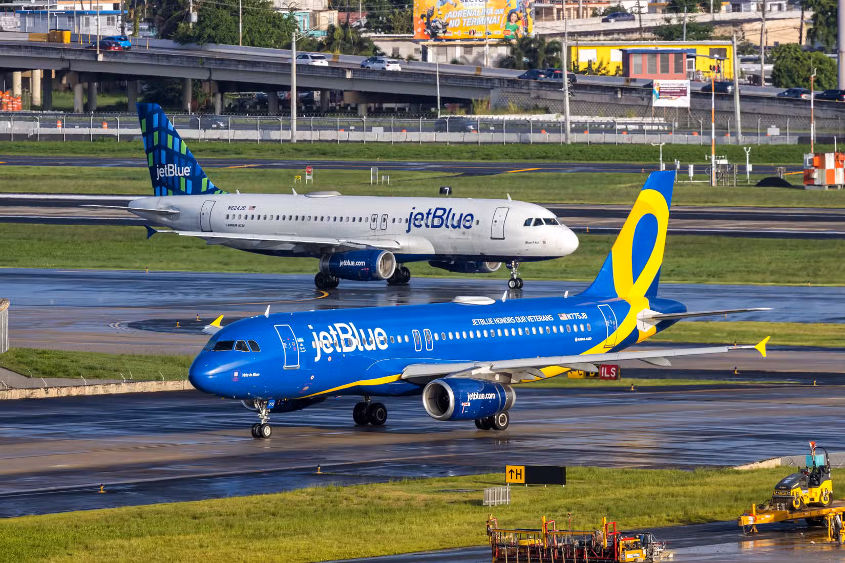 JetBlue Airways Airbus A320 airplane with JetBlue Honors our Veterans special livery at San Juan airport in Puerto Rico.