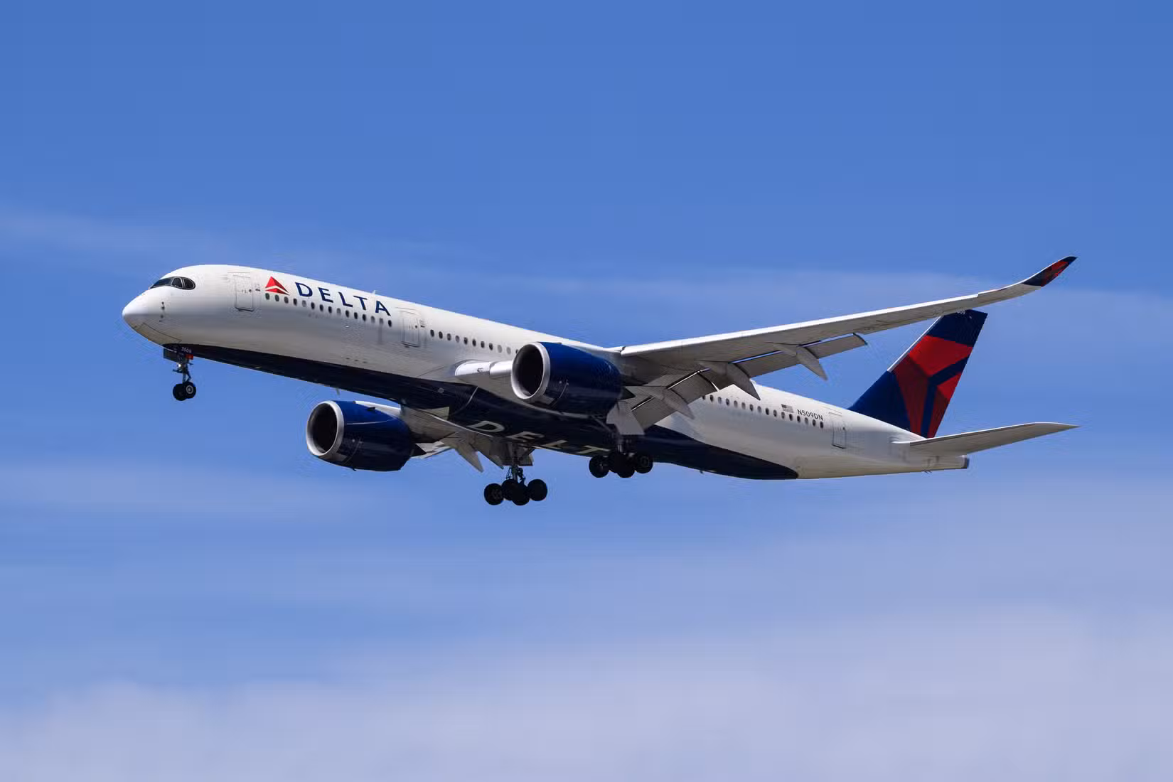 Delta A350-900 flying across clear skies