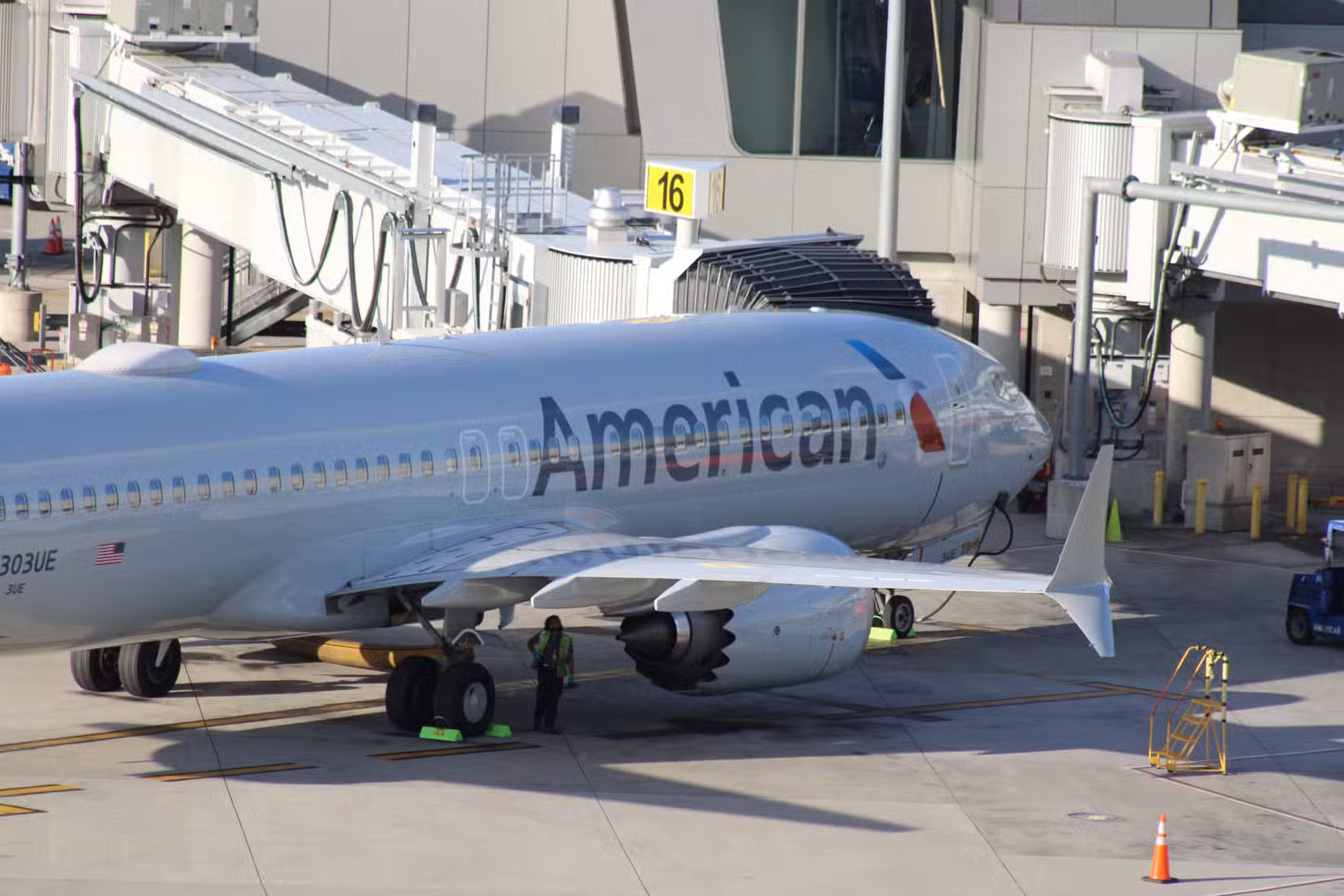 American Airlines Boeing 737 MAX 8 parked at the jet bridge.