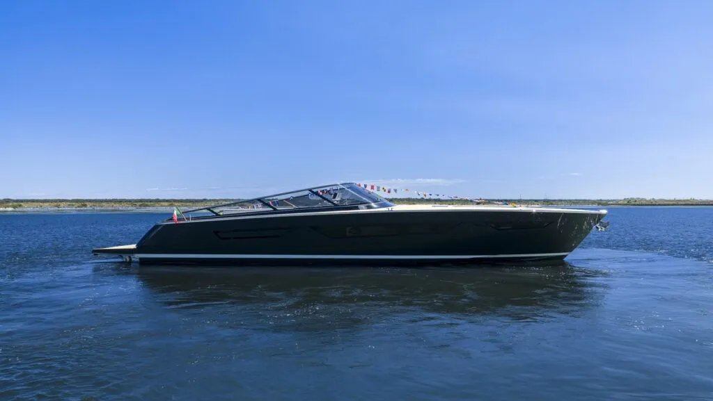 Ferretti Group Itama 70 on the water with flags