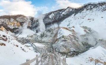Panorama-views-with-wooden-walkway-bridge-of-the-Hell-valley-Hokkaido-Japan-1024x630.jpg