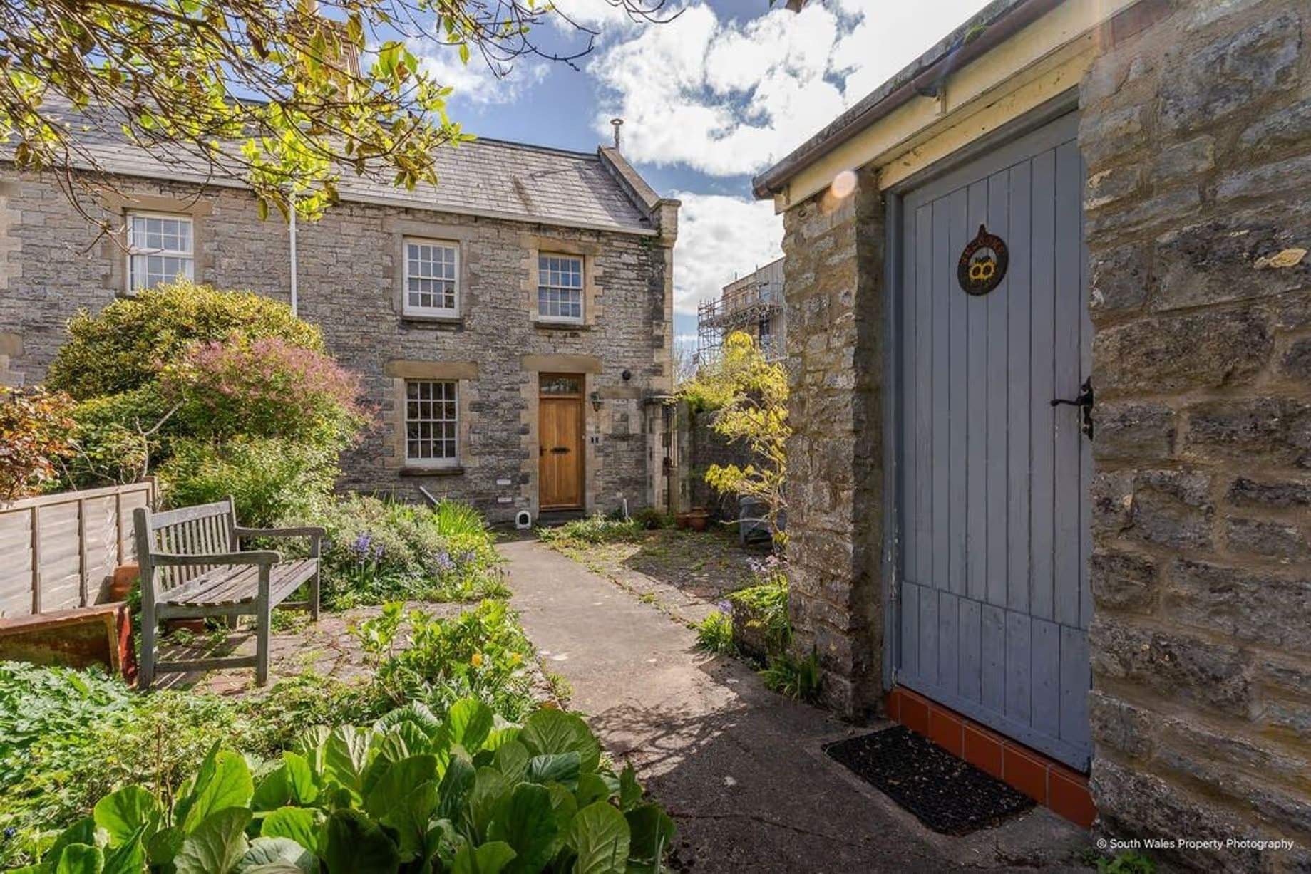 Attractive Georgian-style stone cottage exterior, dating back to 1840, originally a coastguard cottage, Grade II listed, for sale by David Baker (Penarth) with a guide price of over £400,000