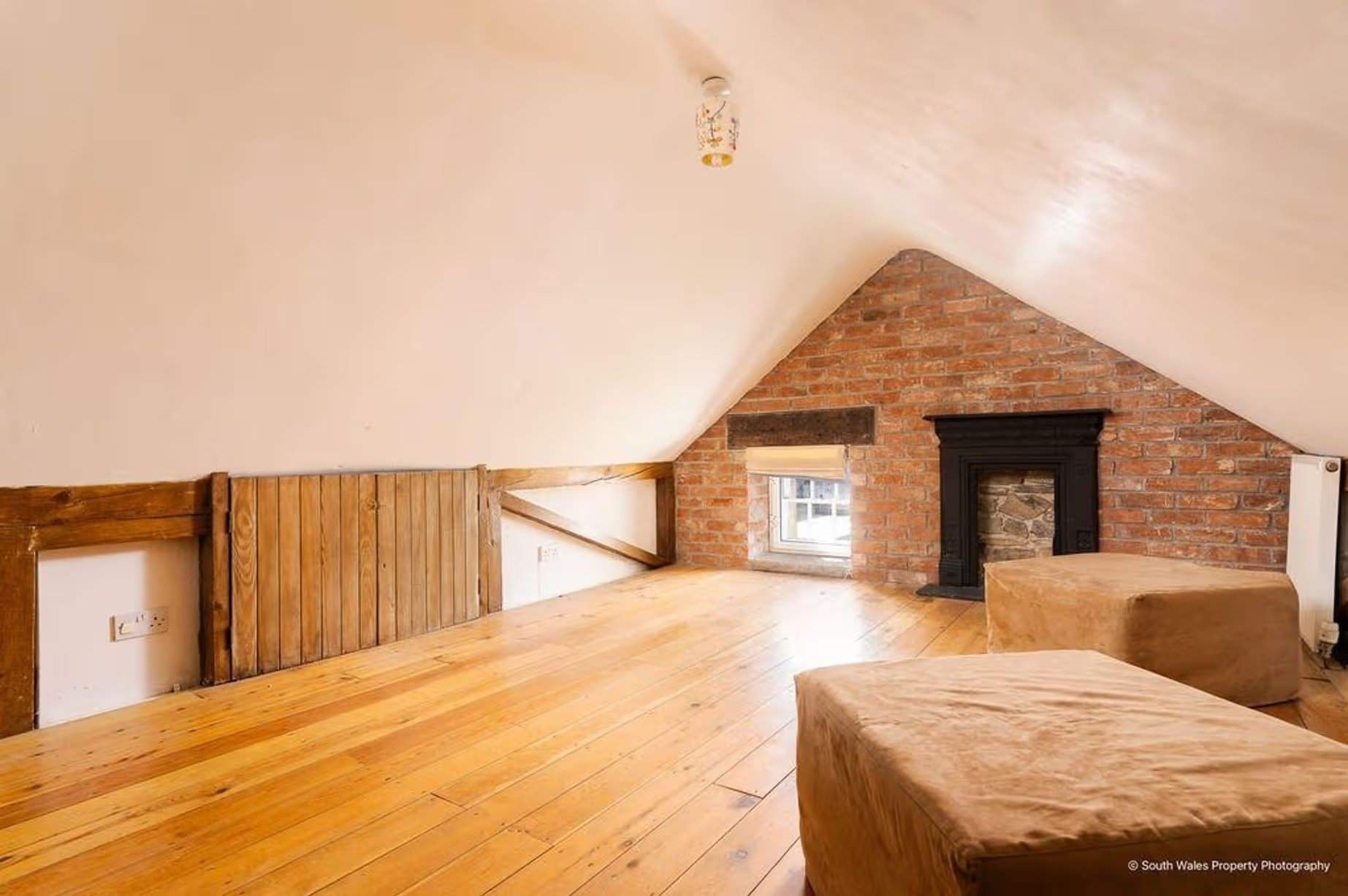 The top floor, invisible from the outside, is a convenient and versatile space full of charm, which could also serve as a home office, a playroom, or a secret games room with a pool table and a large TV that everyone will love, Victorian end-terrace coastguard cottage, Grade II listed, for sale by David Baker (Penarth) with a guide price of over £400,000