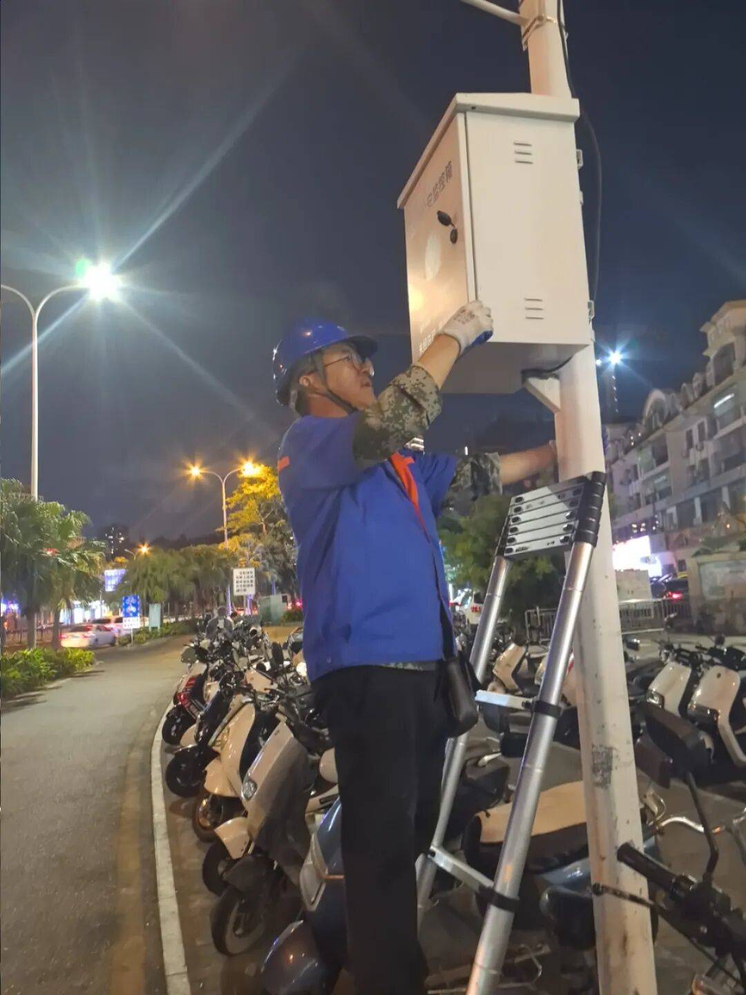 Telecom personnel conduct waterproofing and flood prevention inspections and repair road video surveillance equipment