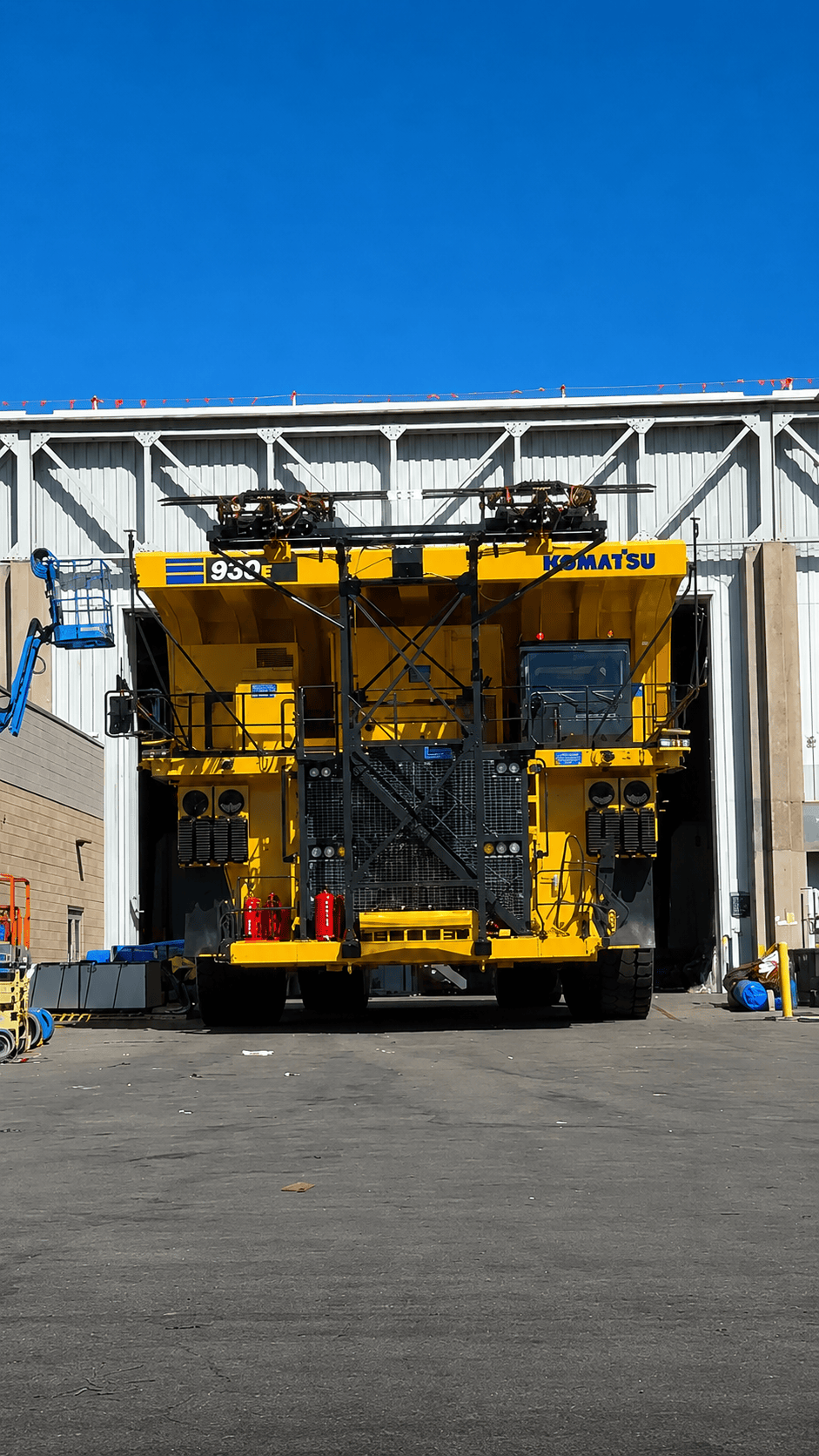 The Komatsu Power Agnostic 930E is a 320-short-ton (290,000 kg) mining haul truck featuring a modular powertrain platform designed to accept multiple energy sources, including diesel, battery-electric, hydrogen fuel cell, or diesel trolley assist. This approach allows operators to transition from diesel to zero-emission technology over time.
