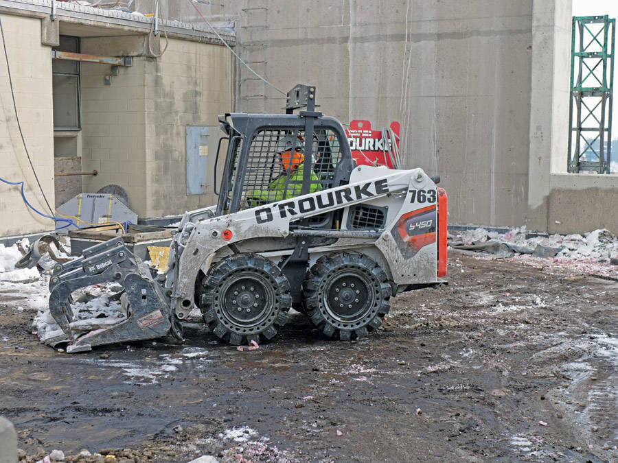Operator stripping roof material