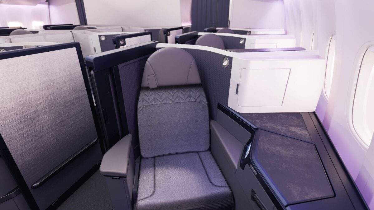 Premium lie-flat aircraft seat with a private enclosed suite and window sidewall