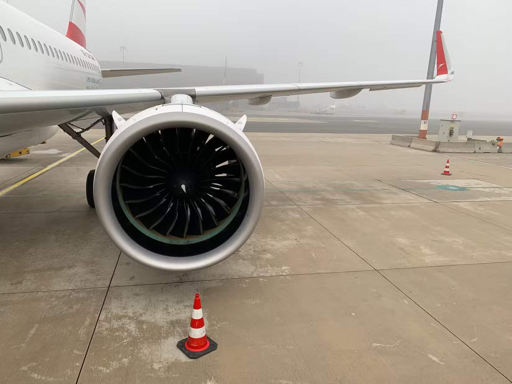 Wing section of Austrian Airlines Airbus A320neo with winglets and modern Pratt and Whitney PW1000G geared turbofan engine